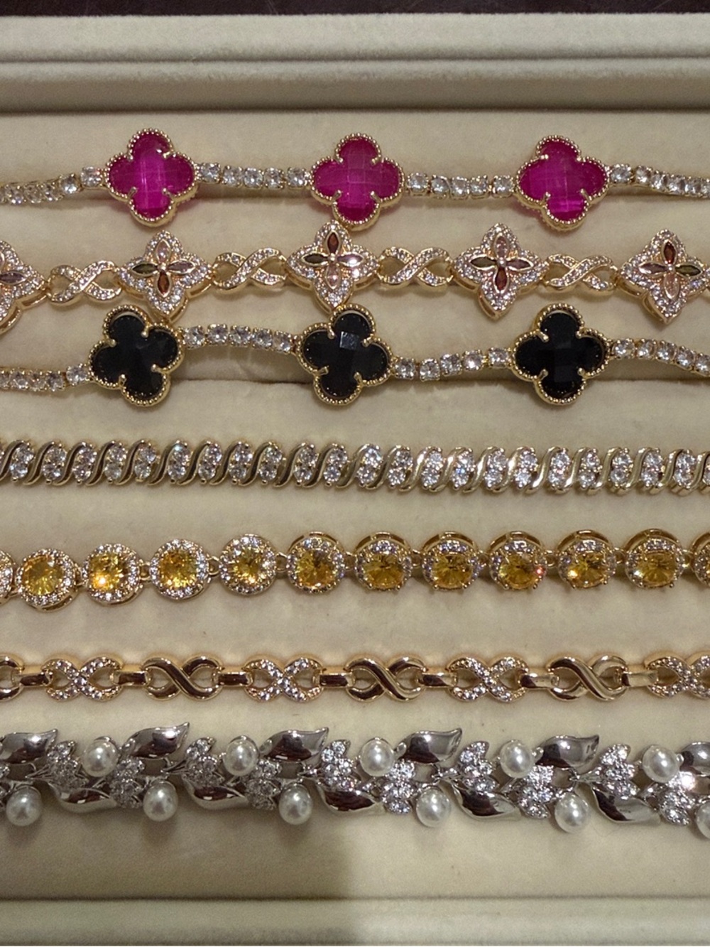 Elegant Women's Gold-Tone Bracelet with Pink, Black and Yellow Gem Accents